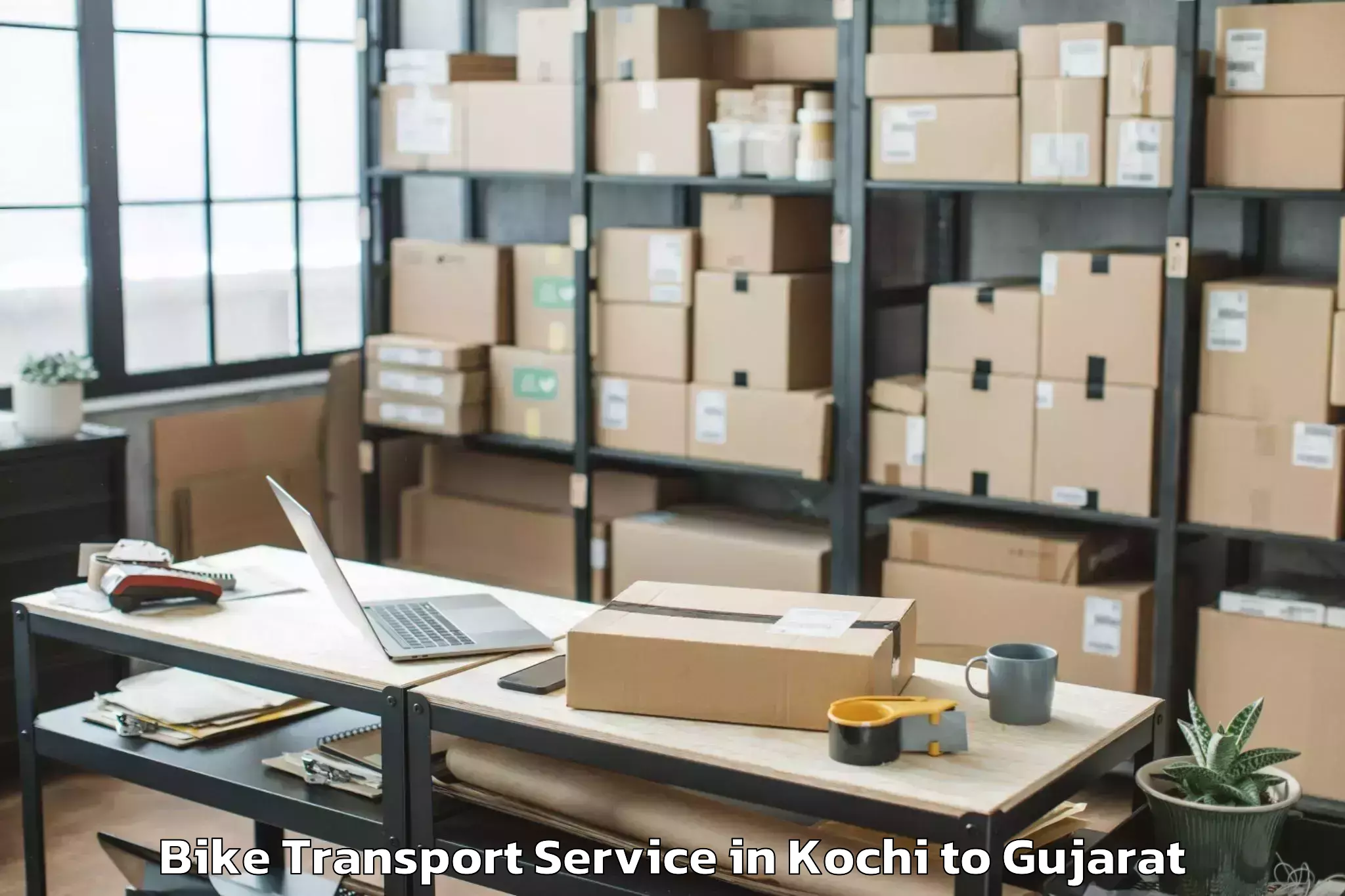 Book Kochi to Rudra Mata Airport Bhj Bike Transport Online